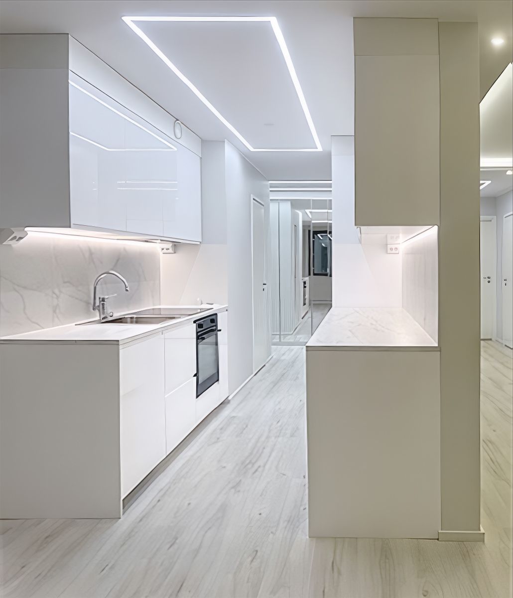 Kitchen worktop illumination with LED strip and general lighting created by LED strip mounted on a recessed aluminium profile.