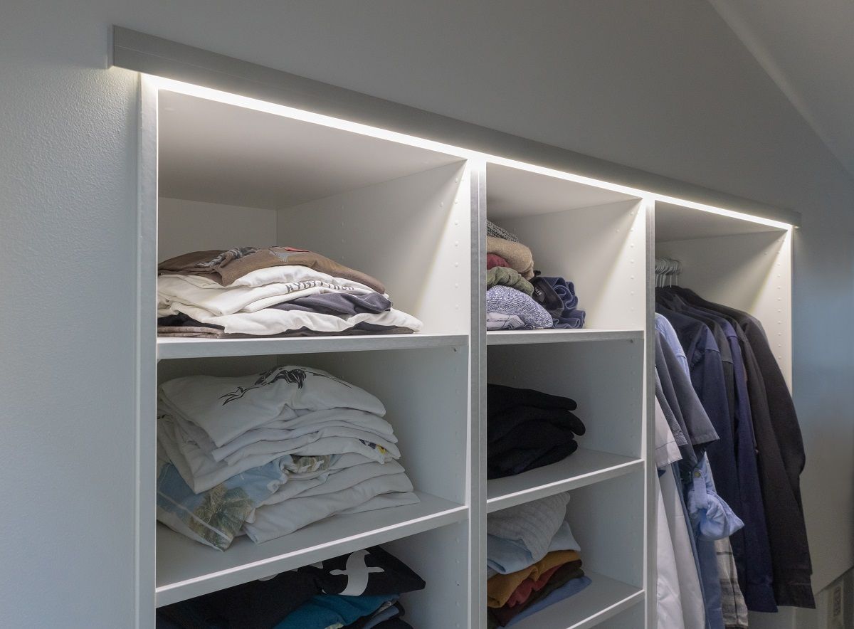 LED strip light mounted on the edge of a shelf.